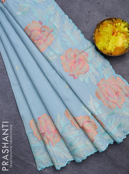 Semi raw silk saree teal blue shade with embroidery work buttas and floral design embroidery work border