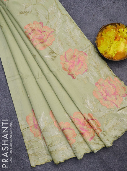 Semi raw silk saree mild pista green with embroidery work buttas and floral design embroidery work border