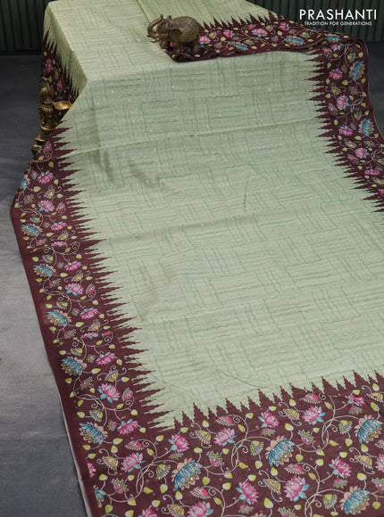 Semi tussar saree pista green and brown with zari woven buttas & prints and temple deisgn kalamkari printed mirror work border