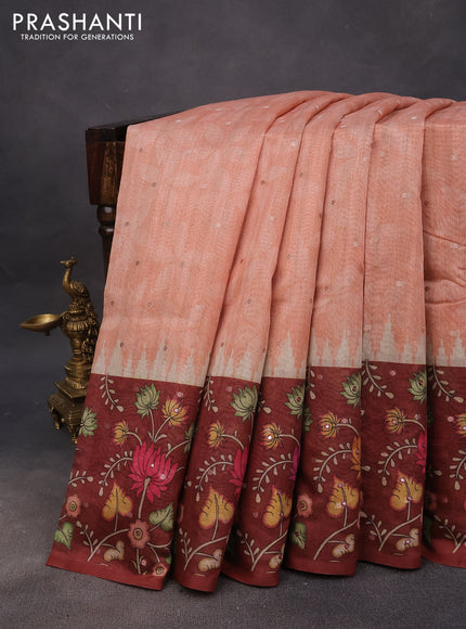 Semi tussar saree peach orange and rust shade with zari woven buttas & prints and temple deisgn kalamkari printed mirror work border