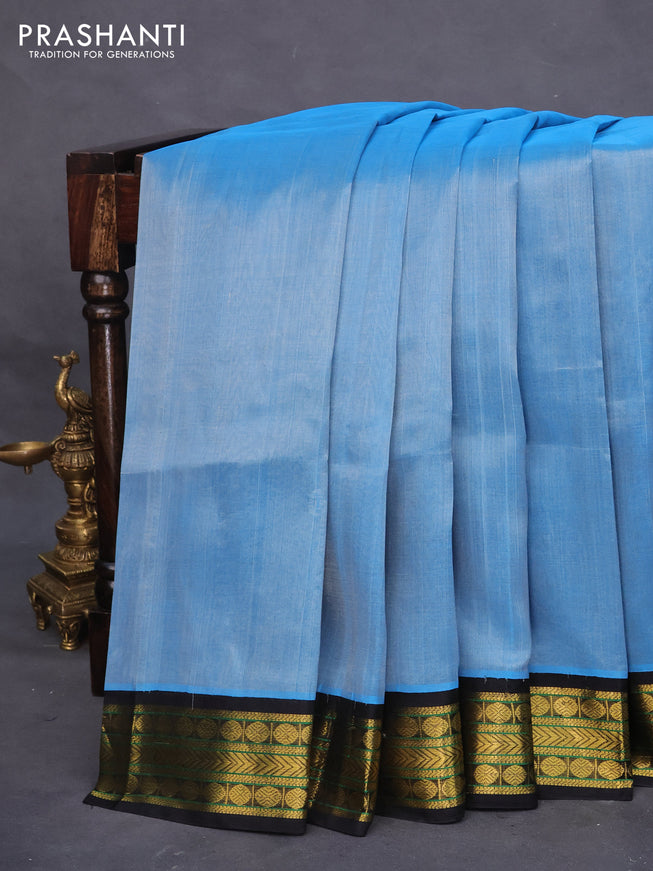 Silk cotton saree light blue and black with plain body and zari woven korvai border