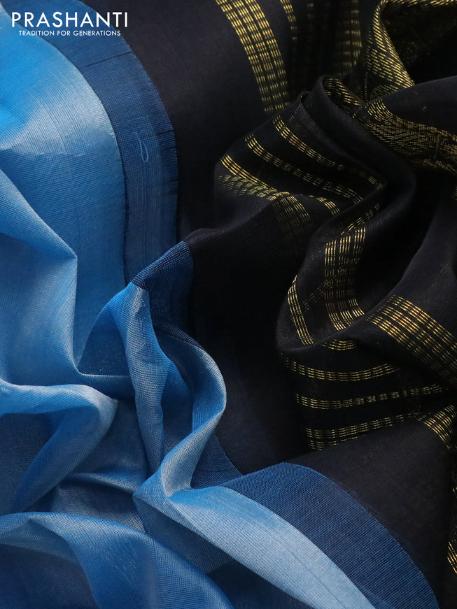 Silk cotton saree light blue and black with plain body and zari woven korvai border