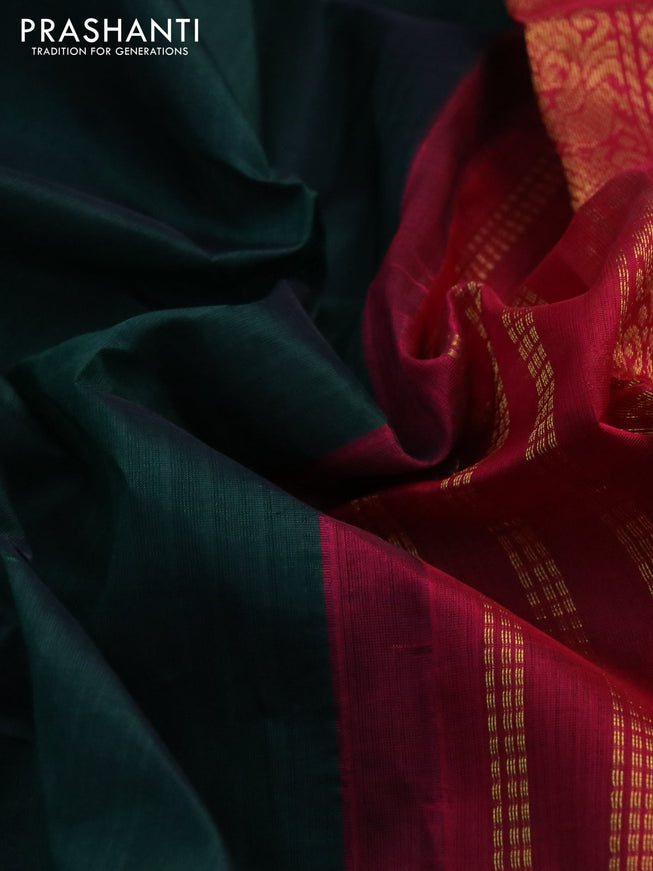 Silk cotton saree dark green and dark pink with plain body and zari woven korvai border