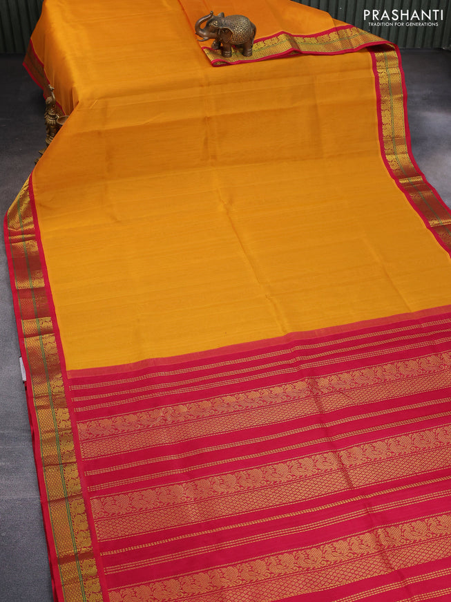 Silk cotton saree mango yellow and pink with plain body and zari woven korvai border