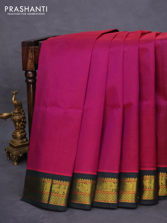 Silk cotton saree purple and dark green with plain body and zari woven korvai border