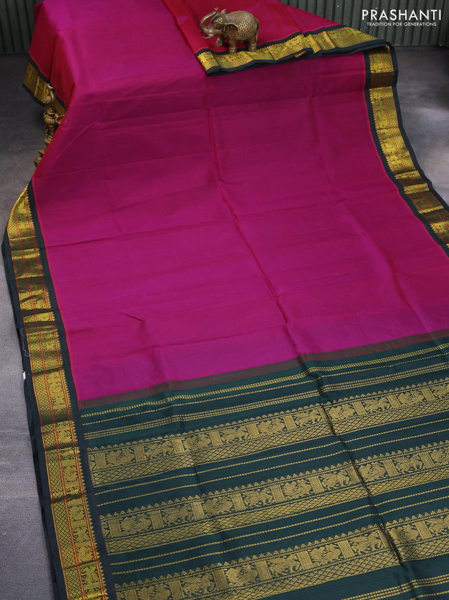 Silk cotton saree purple and dark green with plain body and zari woven korvai border