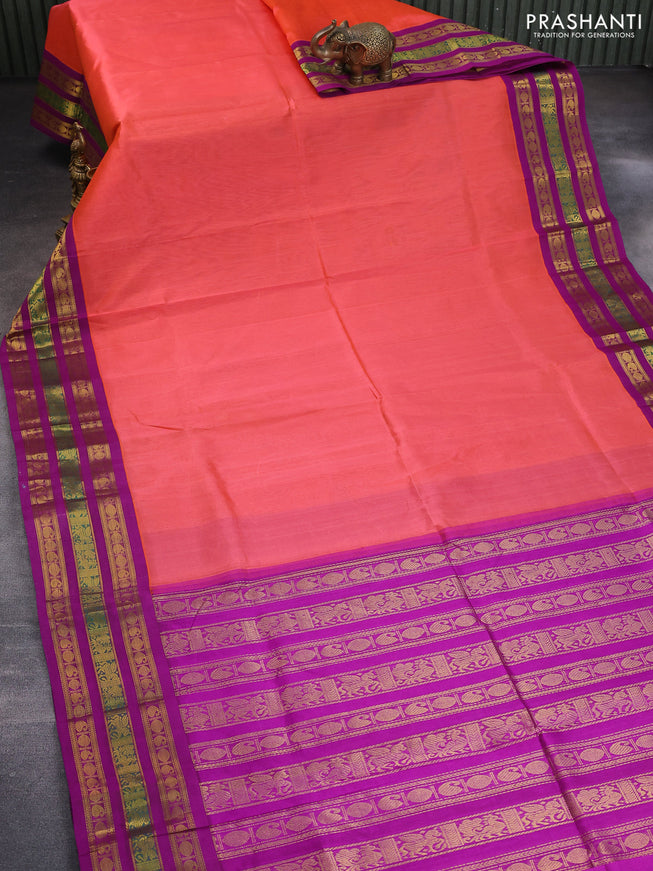 Silk cotton saree peach orange and purple with plain body and long zari woven korvai border