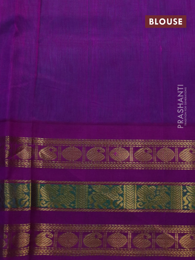 Silk cotton saree teal blue and purple with plain body and long zari woven korvai border