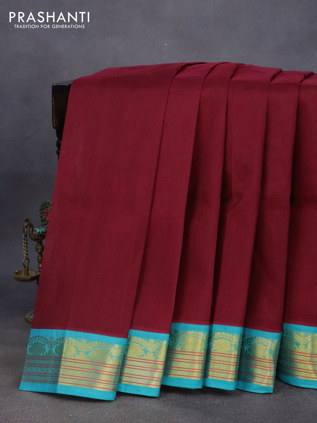 Silk cotton saree maroon and light blue with plain body and zari woven korvai border