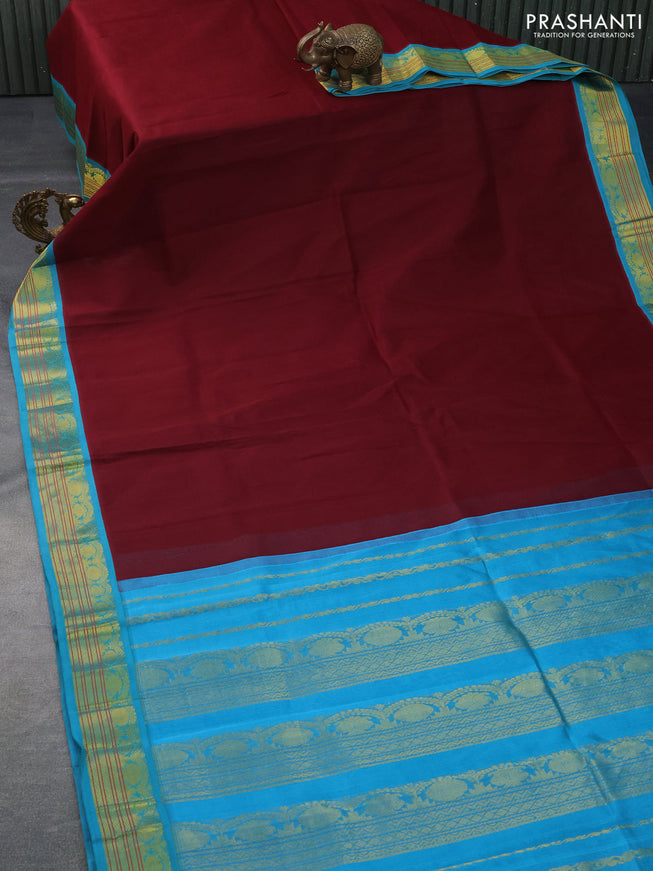 Silk cotton saree maroon and light blue with plain body and zari woven korvai border