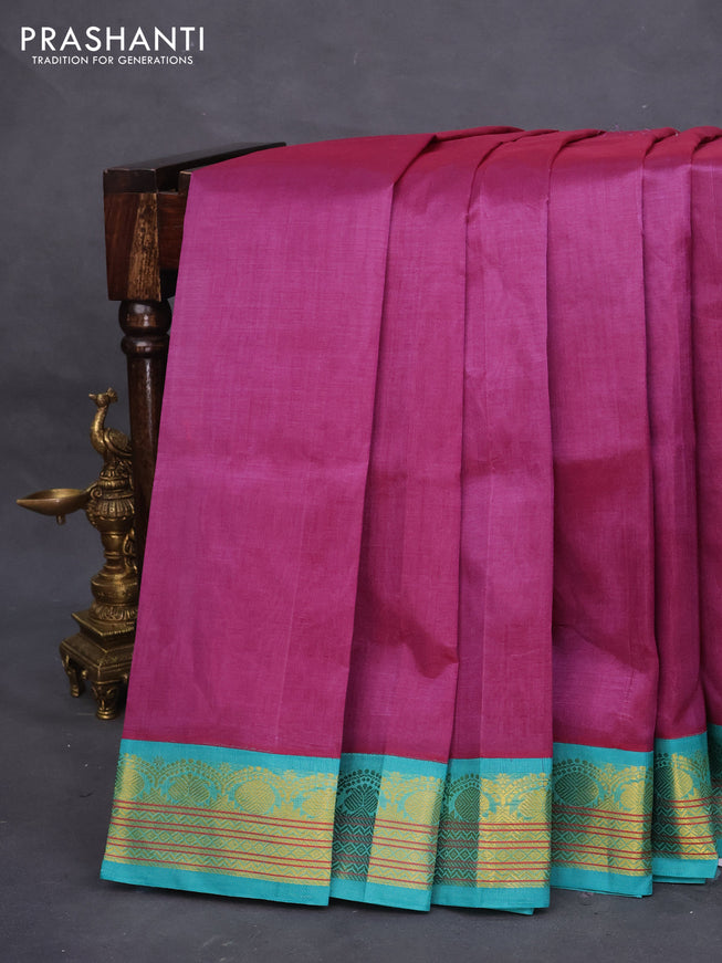 Silk cotton saree purple shade and teal blue with plain body and zari woven korvai border