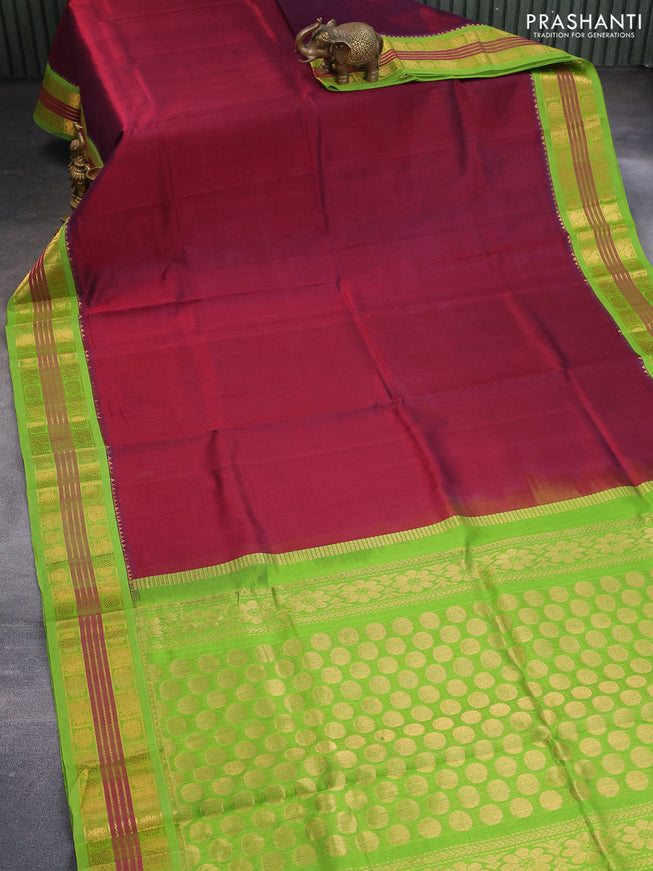 Silk cotton saree maroon and light green with plain body and zari woven korvai border