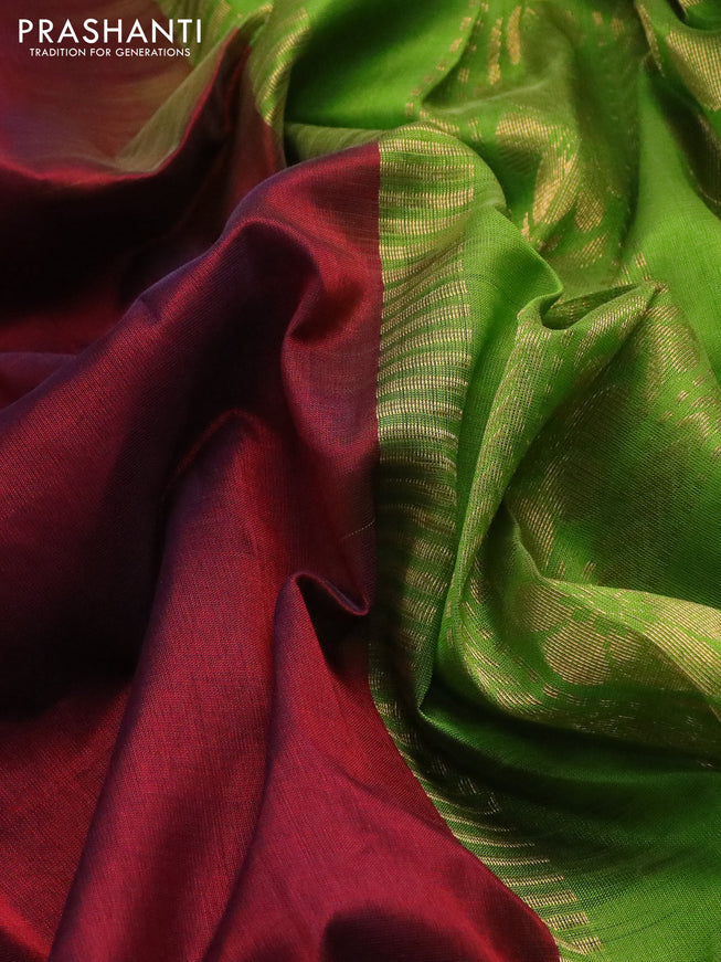 Silk cotton saree maroon and light green with plain body and zari woven korvai border