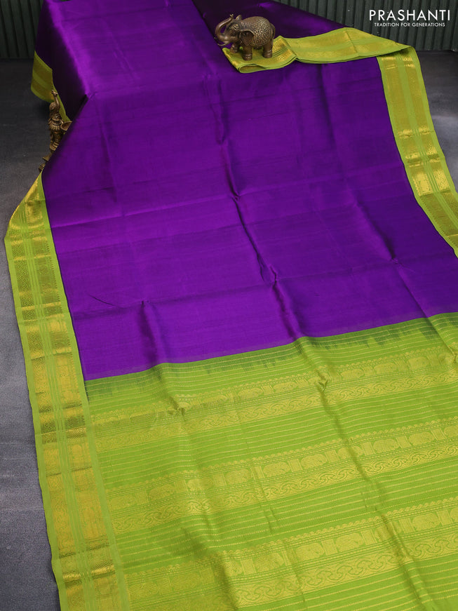 Silk cotton saree violet and light green with plain body and zari woven korvai border