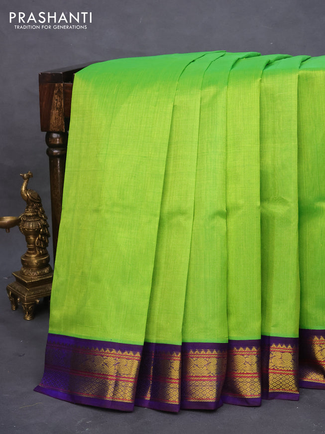 Silk cotton saree light green and blue with plain body and zari woven korvai border