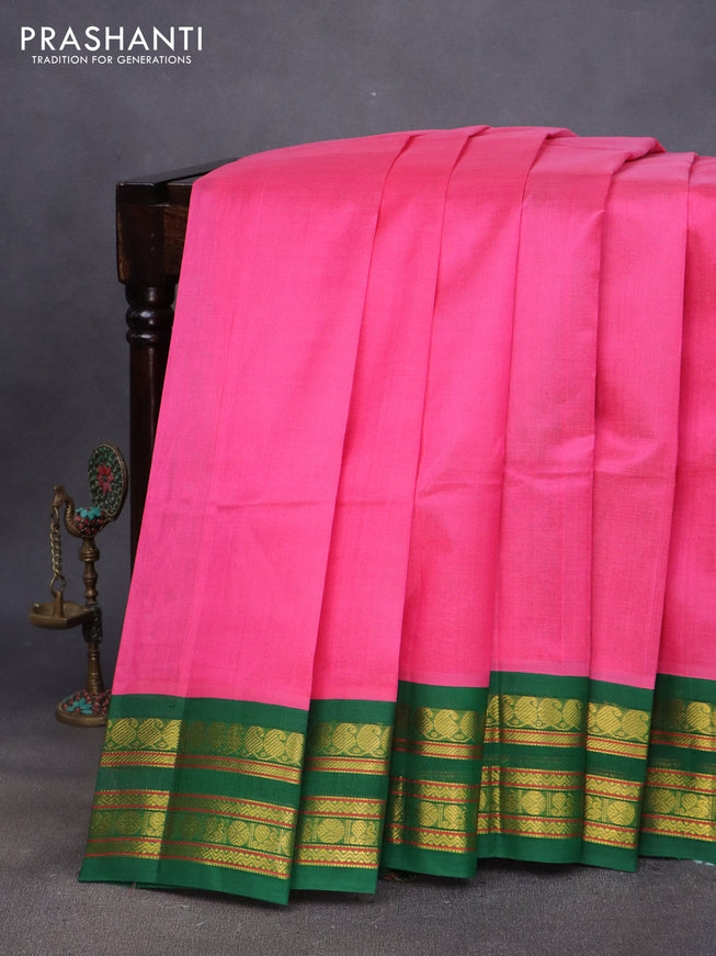 Silk cotton saree pink and green with plain body and zari woven korvai border