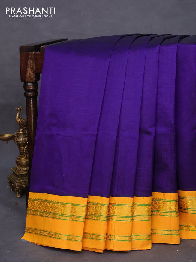 Silk cotton saree blue and mango yellow with plain body and rettapet zari woven korvai border