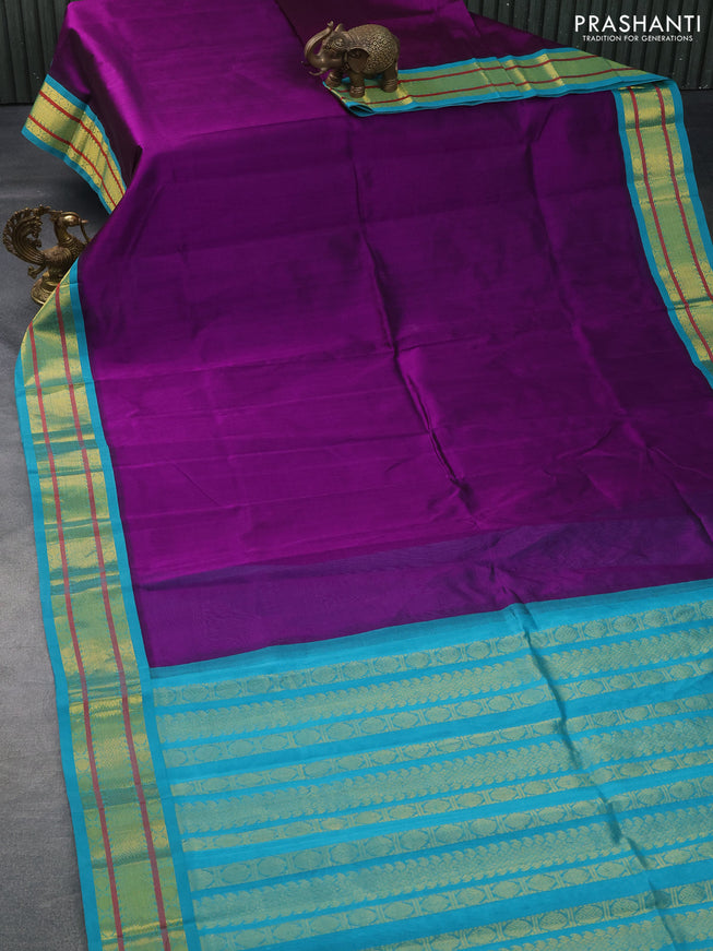 Silk cotton saree purple and teal blue with plain body and zari woven korvai border