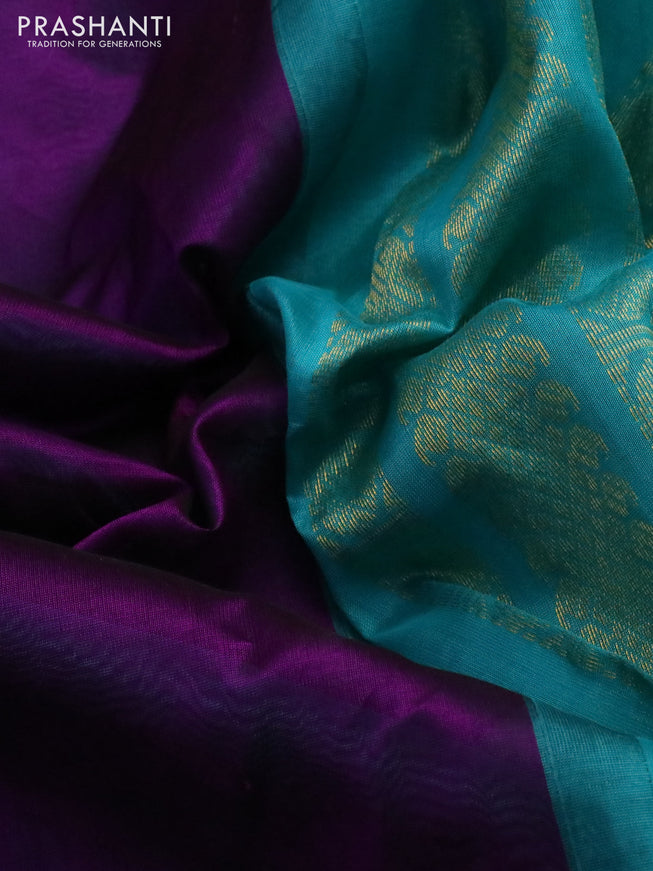 Silk cotton saree purple and teal blue with plain body and zari woven korvai border