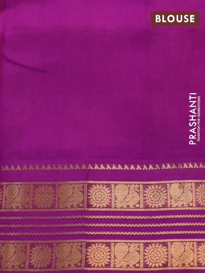 Silk cotton saree yellow and purple with plain body and zari woven korvai border