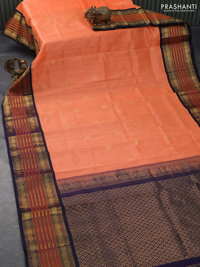 Silk cotton saree peach orange and navy blue with elephant zari woven buttas and long zari woven korvai border