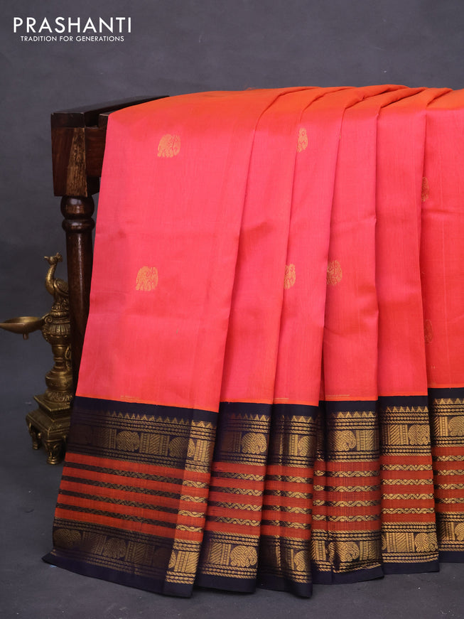 Silk cotton saree peach orange and dark blue with elephant zari woven buttas and long zari woven korvai border