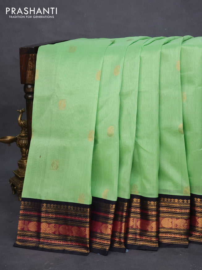 Silk cotton saree pista green and navy blue with zari woven buttas and zari woven korvai border