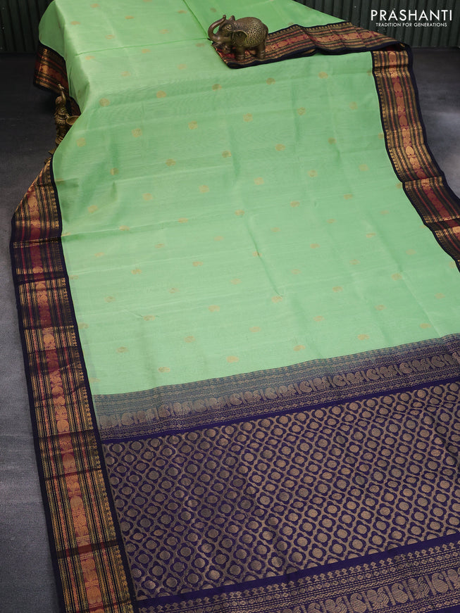 Silk cotton saree pista green and navy blue with zari woven buttas and zari woven korvai border