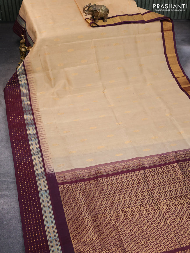 Silk cotton saree sandal and wine shade with zari woven buttas and temple design zari woven border