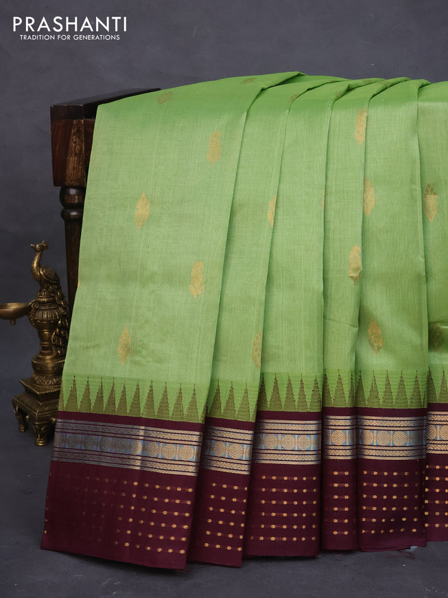 Silk cotton saree light green and wine shade with zari woven buttas and temple design zari woven border