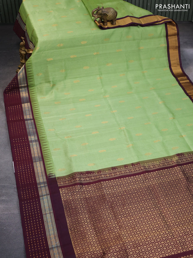 Silk cotton saree light green and wine shade with zari woven buttas and temple design zari woven border