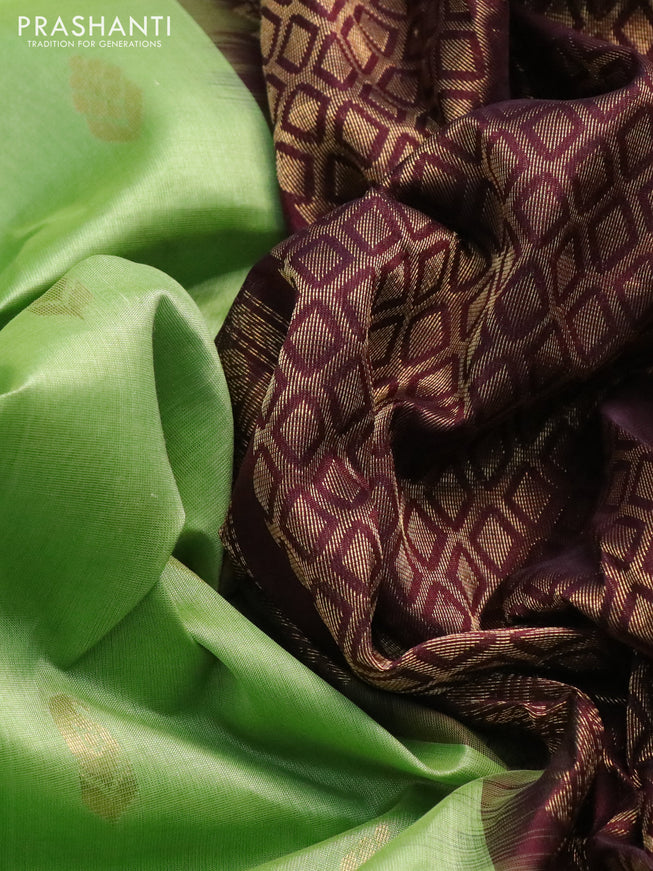 Silk cotton saree light green and wine shade with zari woven buttas and temple design zari woven border