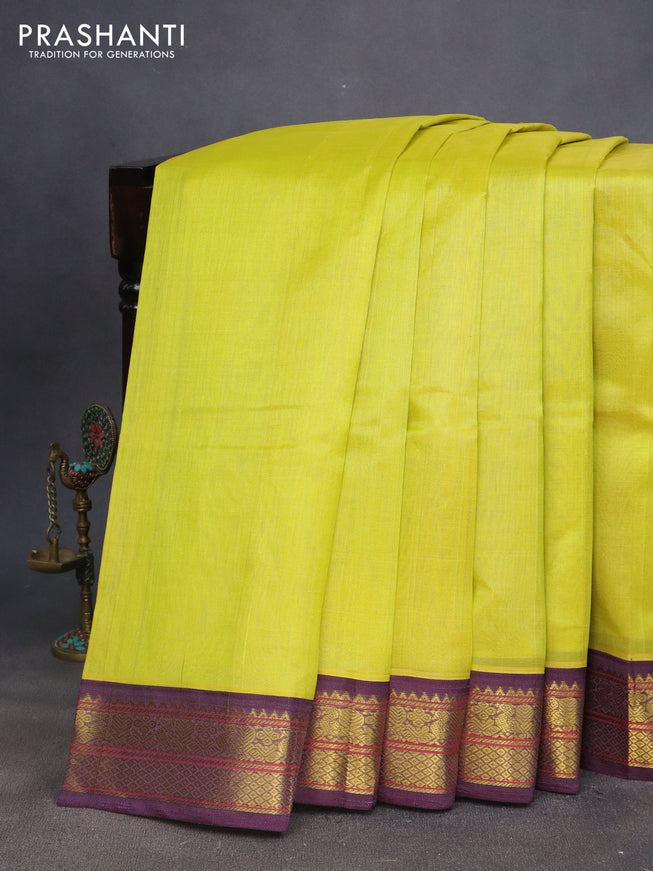 Silk cotton saree lime yellow and deep jamun shade with plain body and zari woven annam border