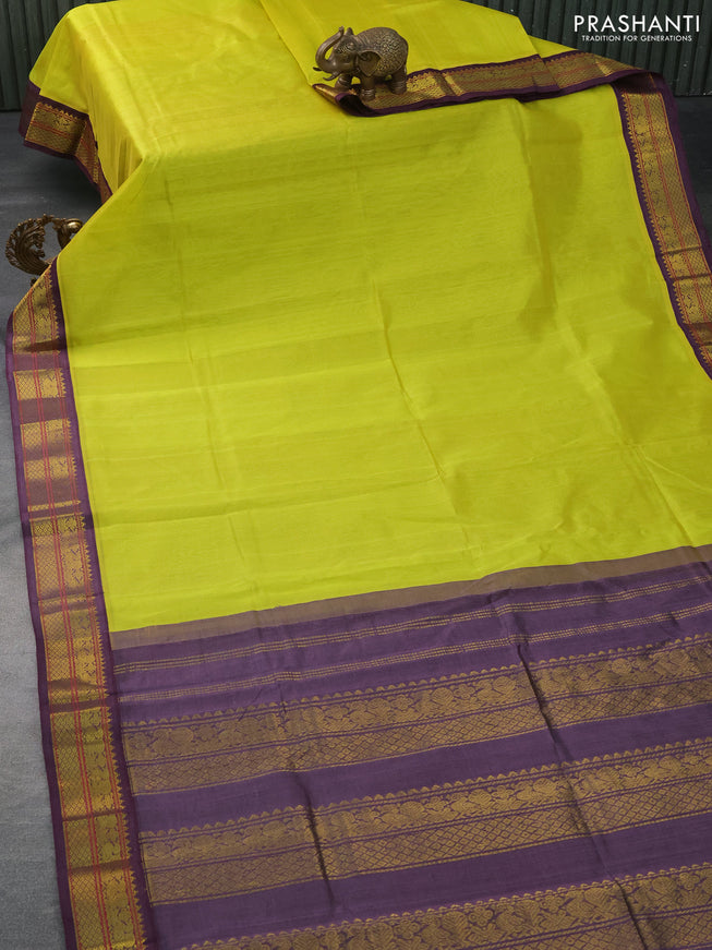 Silk cotton saree lime yellow and deep jamun shade with plain body and zari woven annam border