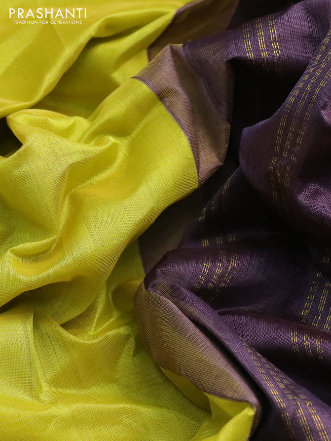 Silk cotton saree lime yellow and deep jamun shade with plain body and zari woven annam border