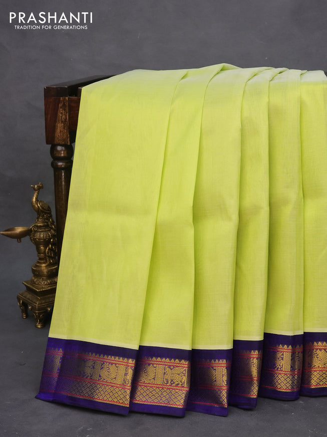 Silk cotton saree pista green and blue with plain body and zari woven korvai border