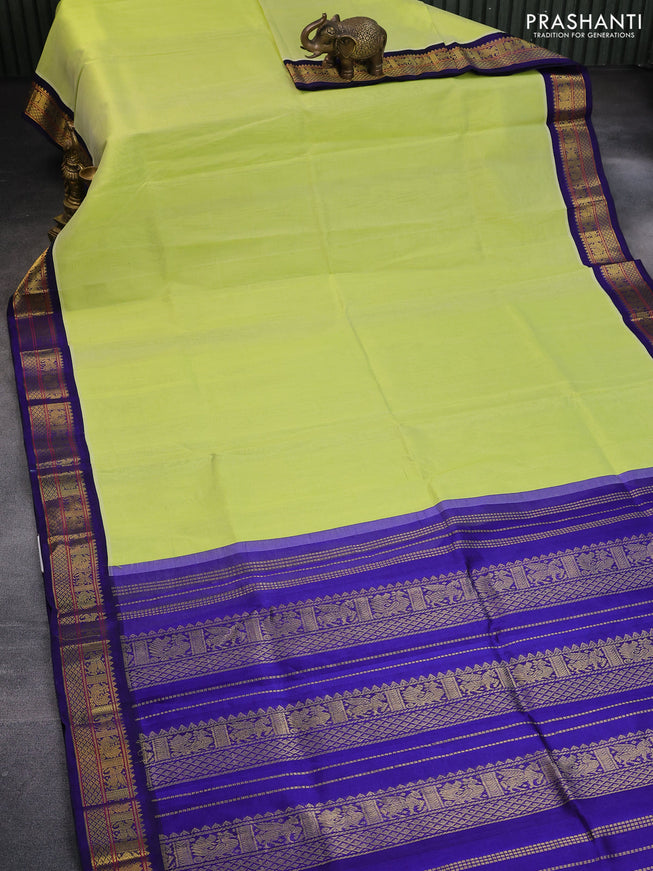 Silk cotton saree pista green and blue with plain body and zari woven korvai border