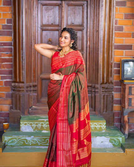 Pure soft silk saree manthulir green and red with allover zari weaves and long zari woven border