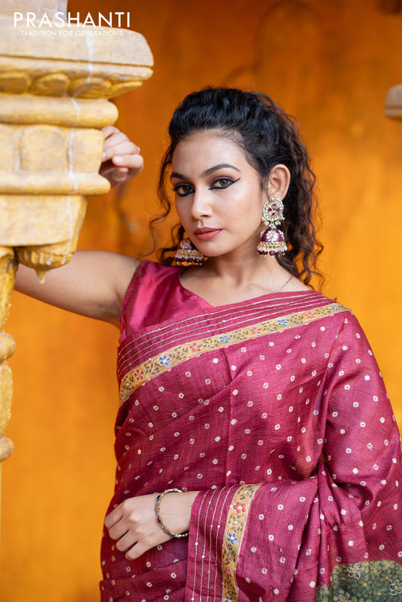 Pure tussar silk saree maroon with allover bandhani butta prints & pita work and zari line border