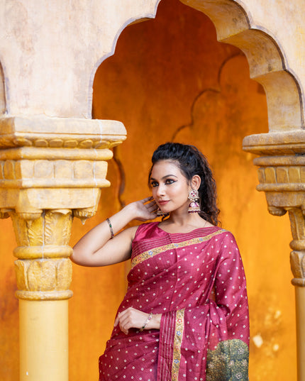 Pure tussar silk saree maroon with allover bandhani butta prints & pita work and zari line border