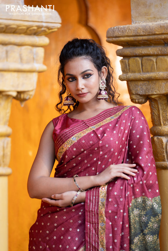 Pure tussar silk saree maroon with allover bandhani butta prints & pita work and zari line border