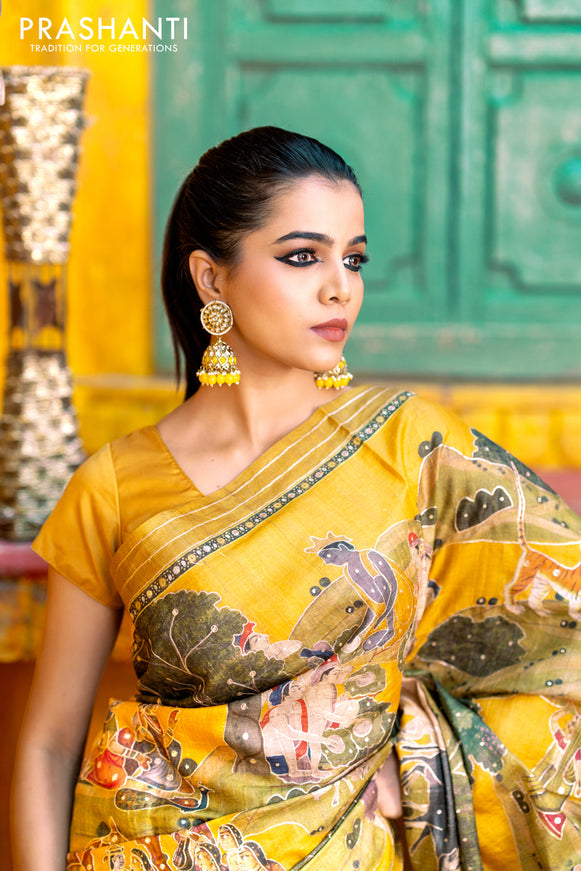 Pure tussar silk saree mustard yellow with allover digital pichwai prints & pita work and zari line border