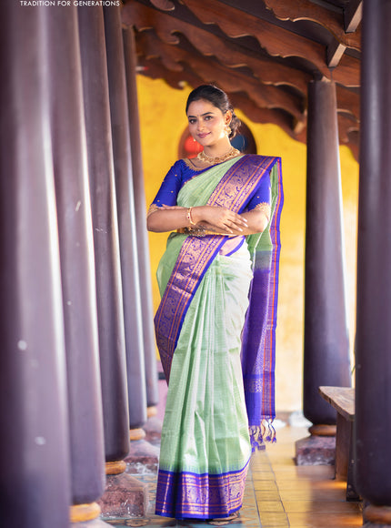 Kuppadam silk cotton saree teal green and blue with allover zari checks & buttas and temple deisgn zari woven border