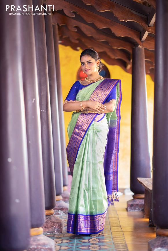 Kuppadam silk cotton saree teal green and blue with allover zari checks & buttas and temple deisgn zari woven border