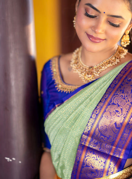 Kuppadam silk cotton saree teal green and blue with allover zari checks & buttas and temple deisgn zari woven border