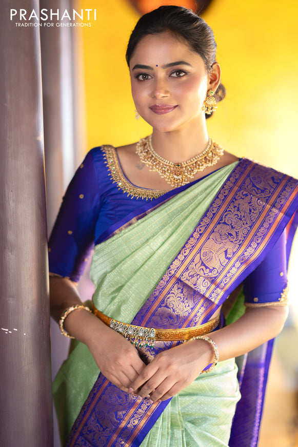 Kuppadam silk cotton saree teal green and blue with allover zari checks & buttas and temple deisgn zari woven border