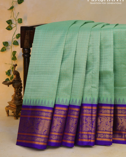 Kuppadam silk cotton saree teal green and blue with allover zari checks & buttas and temple deisgn zari woven border