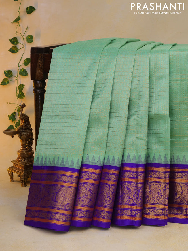 Kuppadam silk cotton saree teal green and blue with allover zari checks & buttas and temple deisgn zari woven border