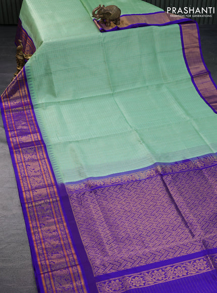 Kuppadam silk cotton saree teal green and blue with allover zari checks & buttas and temple deisgn zari woven border