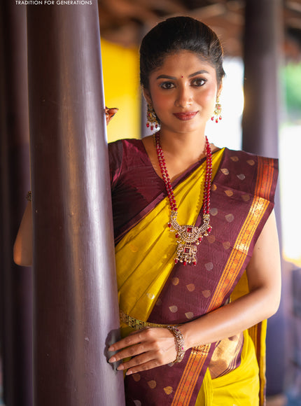 Kuppadam silk cotton saree lime yellow and deep maroon with silver & gold zari woven tilak buttas and temple design rettapet zari woven butta border